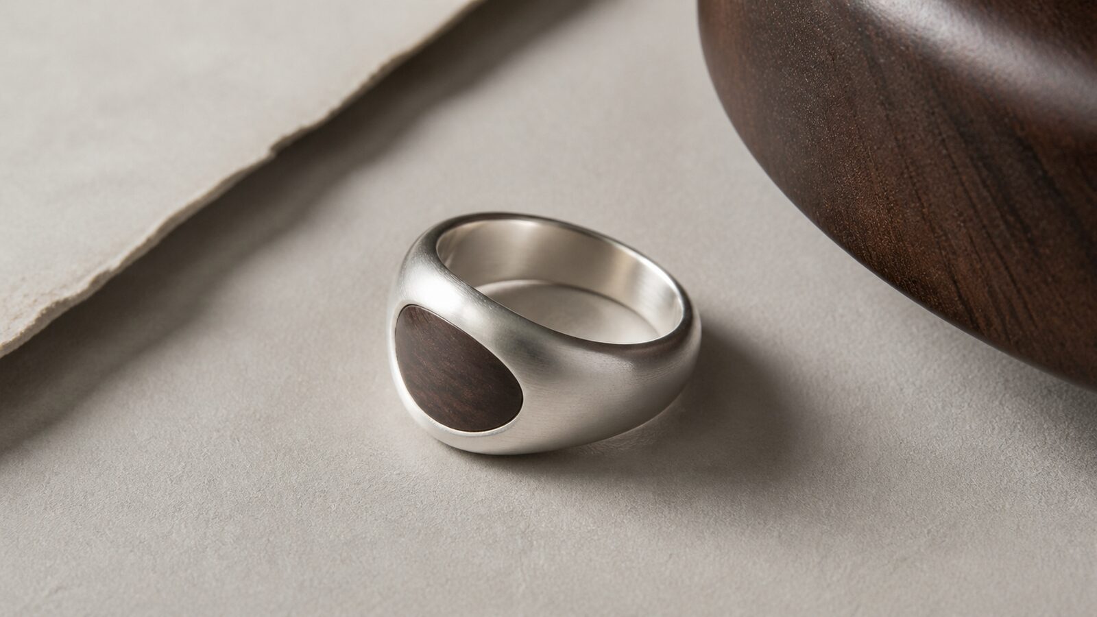 Contemporary matte silver and wood jewelry concept