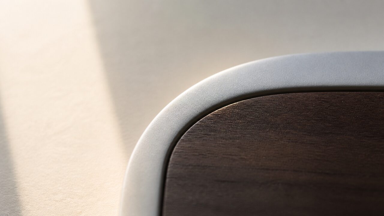 Fine wood grain beside matte silver